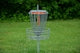 a frisbee golf cage in the middle of a field