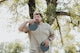 a man holding a frisbee