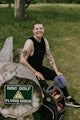 a person sitting on a log
