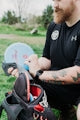 Man with beard and tattoos holding a disc golf disc