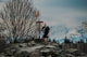 Man playing disc golf with mountains in background